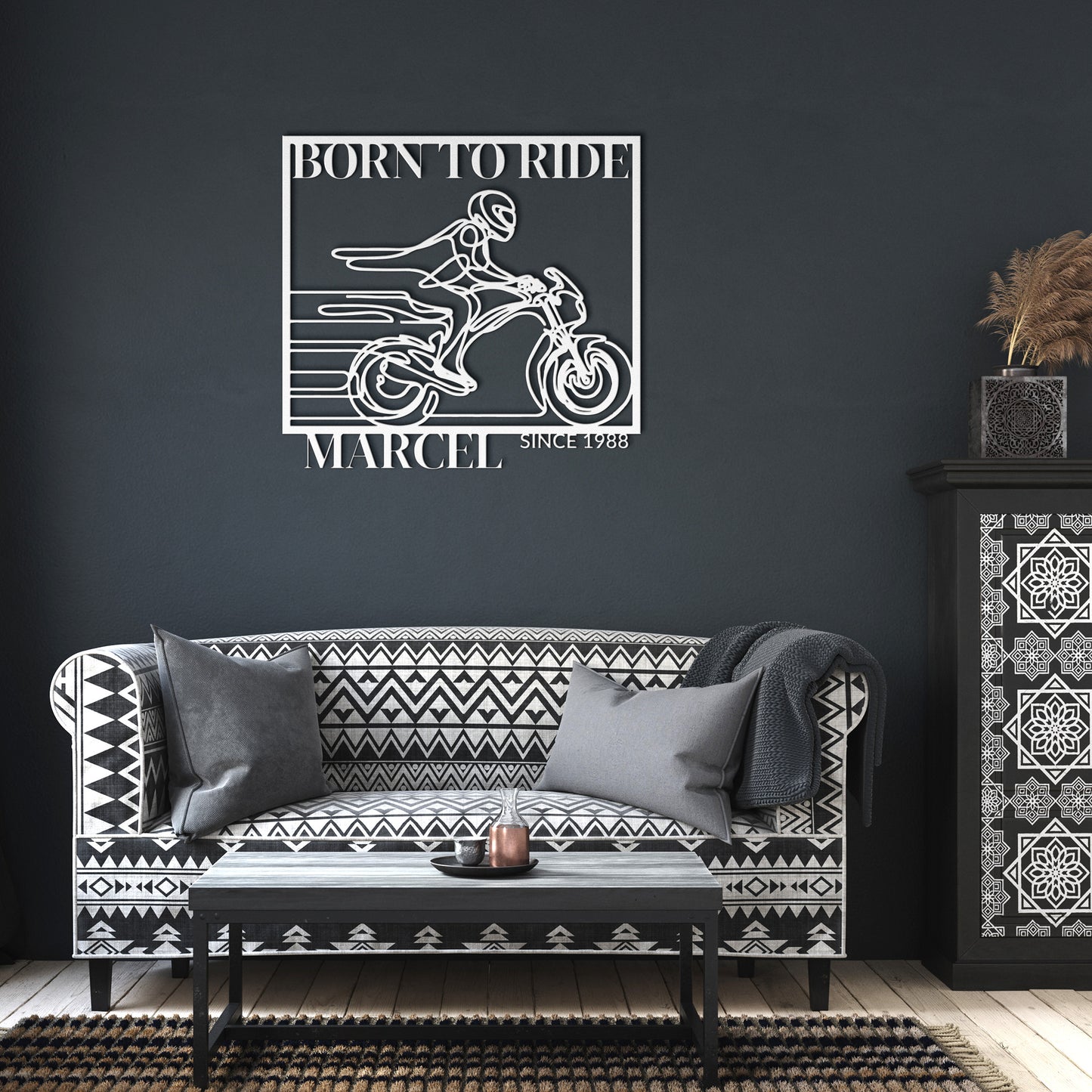 The Biking Metal Line Art, featuring a motorcyclist with the text "Born to Ride Marcel Since 1988," makes for a stunning home decor piece. Crafted from durable 18 gauge steel, this metal sign is built to last.