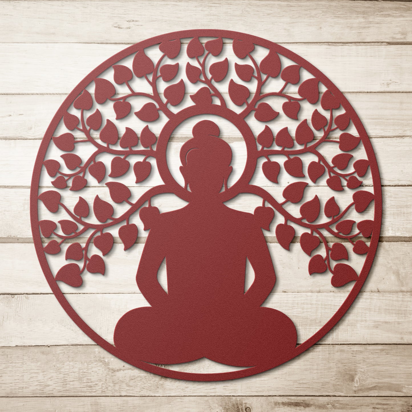 A wooden door with an arched window and brass handle is set in a brick wall. A round, powder-coated metal sign featuring the Buddhist Mandala Metal Art depicting a meditating figure under a tree and a potted plant are next to the door, adding charm to the home decor.