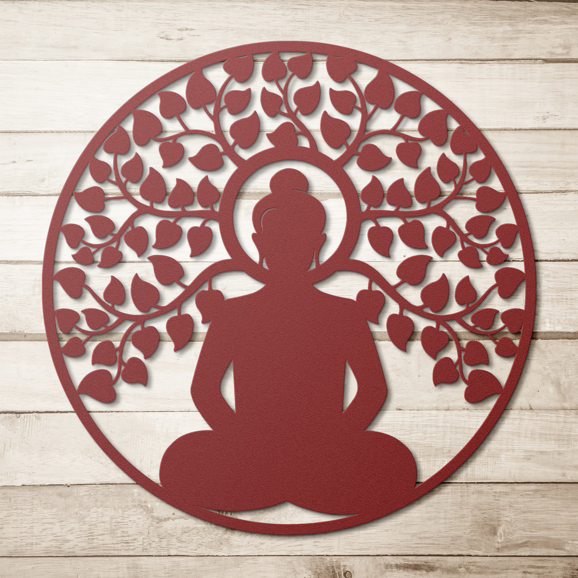 A wooden door with an arched window and brass handle is set in a brick wall. A round, powder-coated metal sign featuring the Buddhist Mandala Metal Art depicting a meditating figure under a tree and a potted plant are next to the door, adding charm to the home decor.