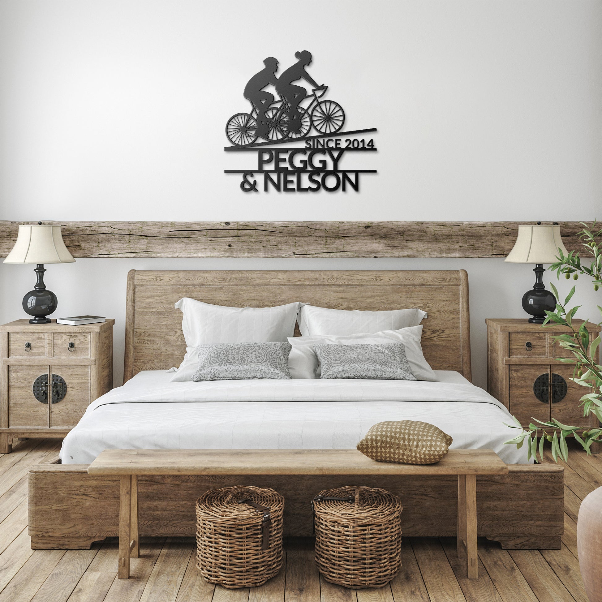 A personalized bedroom with a Personalized Couple Cycling Uphill Metal Wall Art Sign by teelaunch and a bedside table.