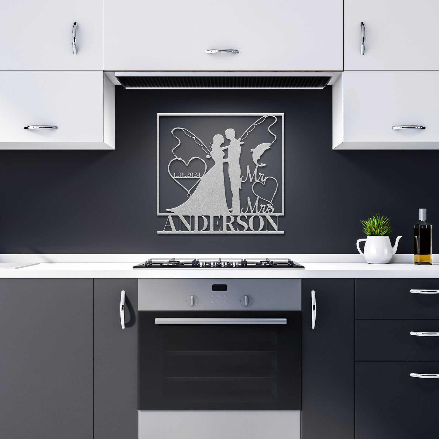 A modern kitchen showcases black and white cabinets, a stove, and a striking Custom Fishing Couple Metal Wall Art with the personalized last name "Anderson" featuring a wedding silhouette above - the perfect anniversary gift.