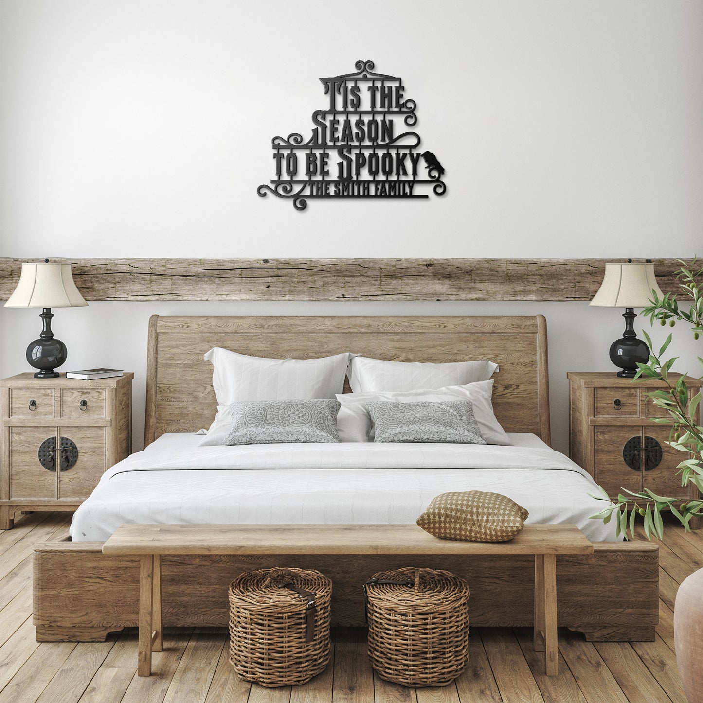 A brick wall with a wooden arched door and a Custom Halloween Metal Sign reading "Tis the season to be spooky." A potted plant with white flowers is placed on the left side of the door.