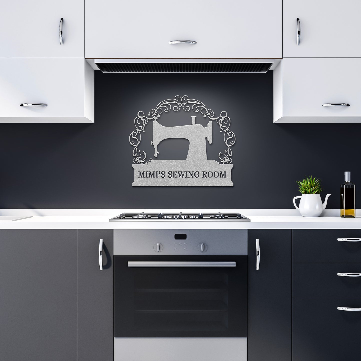 A modern kitchen with black and white cabinets and an oven, featuring the Custom Sewing Room Metal Sign, which displays a sewing machine design and reads "Mimi's Sewing Room." This distinctive piece of home decor perfectly enhances the space, bringing a touch of charm to the contemporary setting.