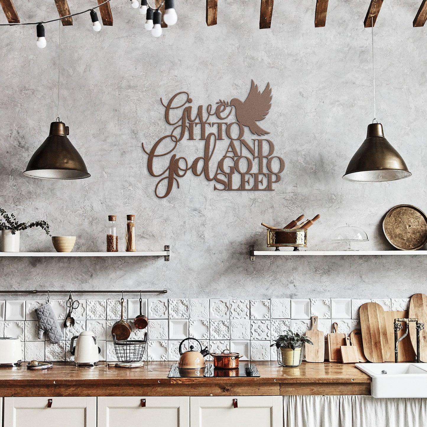 A rustic kitchen with wooden beams, pendant lights, open shelves, and a "Give It To God And Go To Sleep Christian Metal Sign" on the wall.