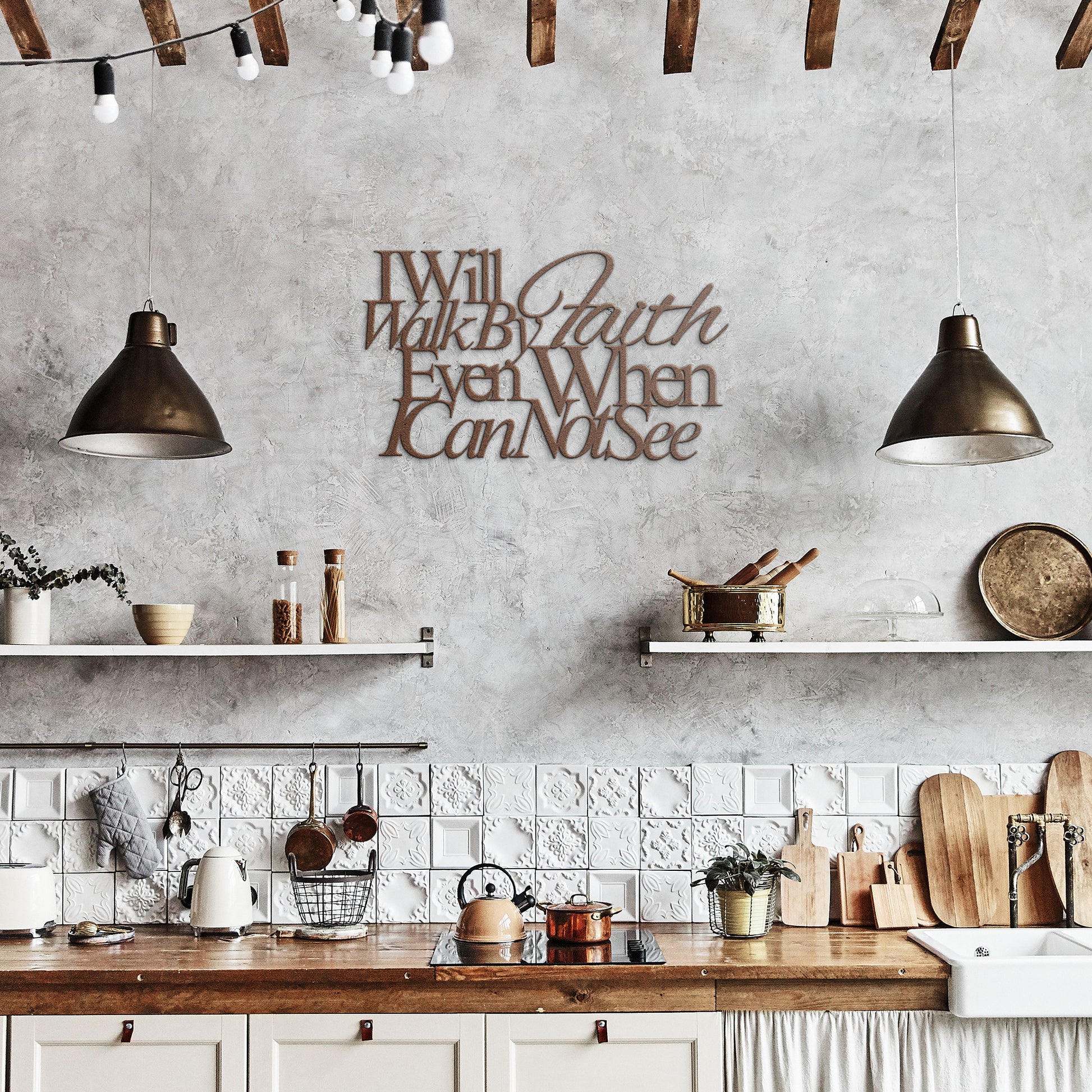 A wooden front door with a decorative glass panel is framed by bricks. A potted plant sits on the left, and an outdoor light hangs above. On the wall, a sign made of 18 gauge steel reads, "I Will Walk By Faith Even When I Cannot See," showcasing the Christian Metal Art piece.