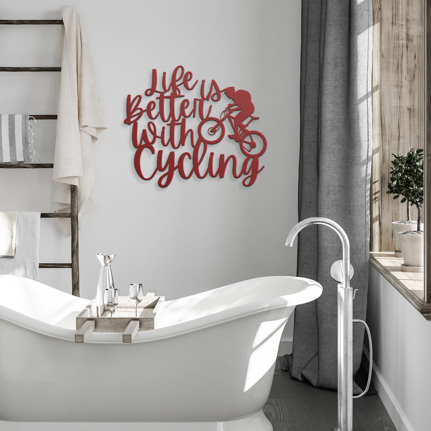 A brick wall with a wooden door, a durable Life Is Better With Cycling Metal Art sign, an exterior light, and a small potted plant with white flowers.