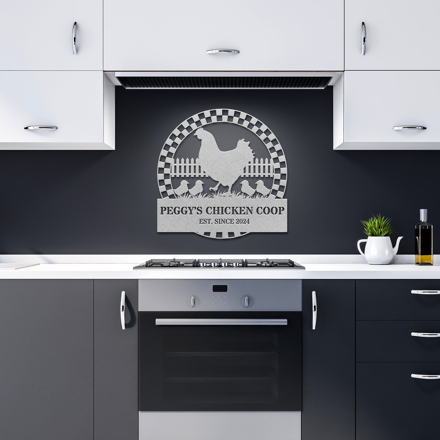A kitchen adorned with black and white cabinets and an oven is beautifully enhanced by the Personalized Chicken Coop Metal Sign. This charming piece, crafted from 18-gauge steel, features a delightful design of a chicken and chicks along with the phrase "Peggy’s Chicken Coop Est. Since 2024," making it perfect decor to add character to the space.