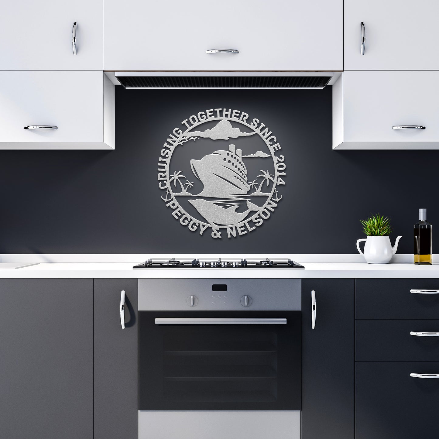 A contemporary kitchen featuring black and white cabinetry, a sleek silver oven, and personalized Cruise Couples Metal Wall Art showcasing a cruise ship with the inscription "Cruising Together Since 2014 Peggy & Nelson.