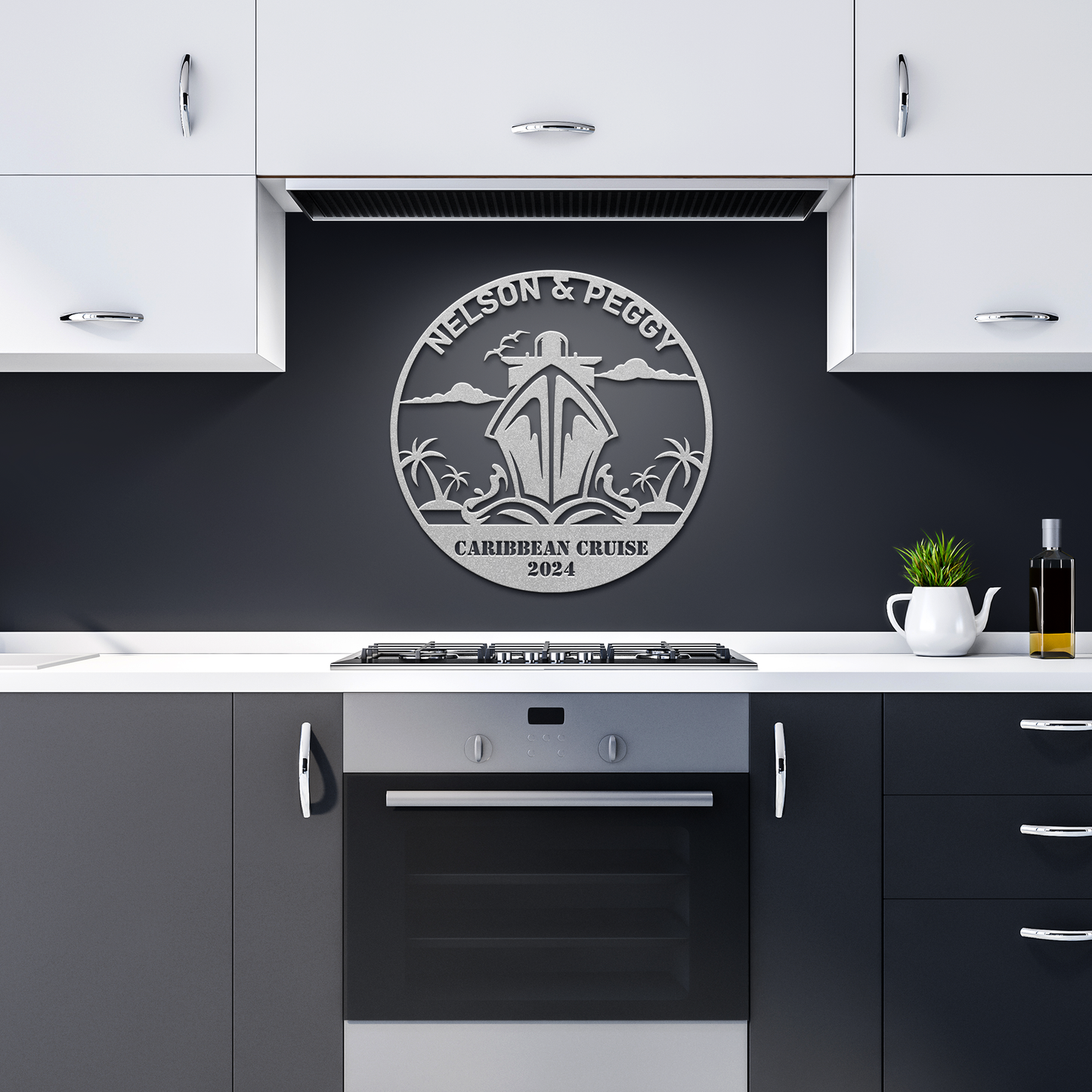 A modern kitchen showcases black and white cabinetry, enhanced by a striking piece of personalized metal wall decor entitled "Nelson & Peggy Caribbean Cruise 2024." Crafted from 18 gauge steel, this artwork features a sailboat and palm trees design, providing a unique home decor touch.
