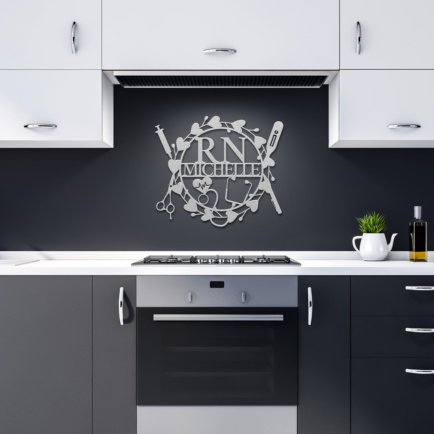 A modern kitchen with black and white cabinetry features a sleek Personalized Nurse Metal Sign made from 18 gauge steel displaying "RN Michelle" above the stove, adding a touch of sophisticated home decor.
