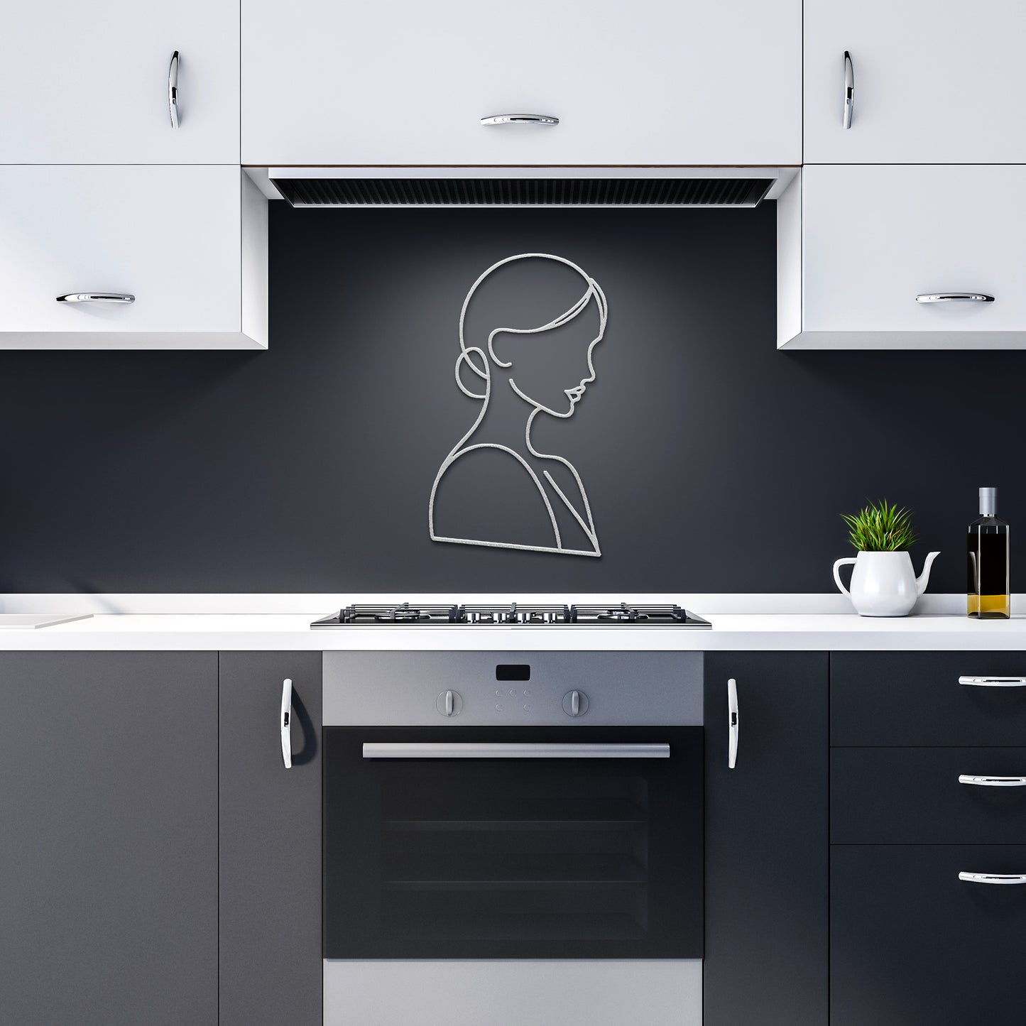A minimalist kitchen features black and white cabinets, a modern oven, stovetop, and the "Woman Line Art" portrait on a dark backsplash. A powder-coated metal sign adds an artistic touch, enhancing the overall home decor.