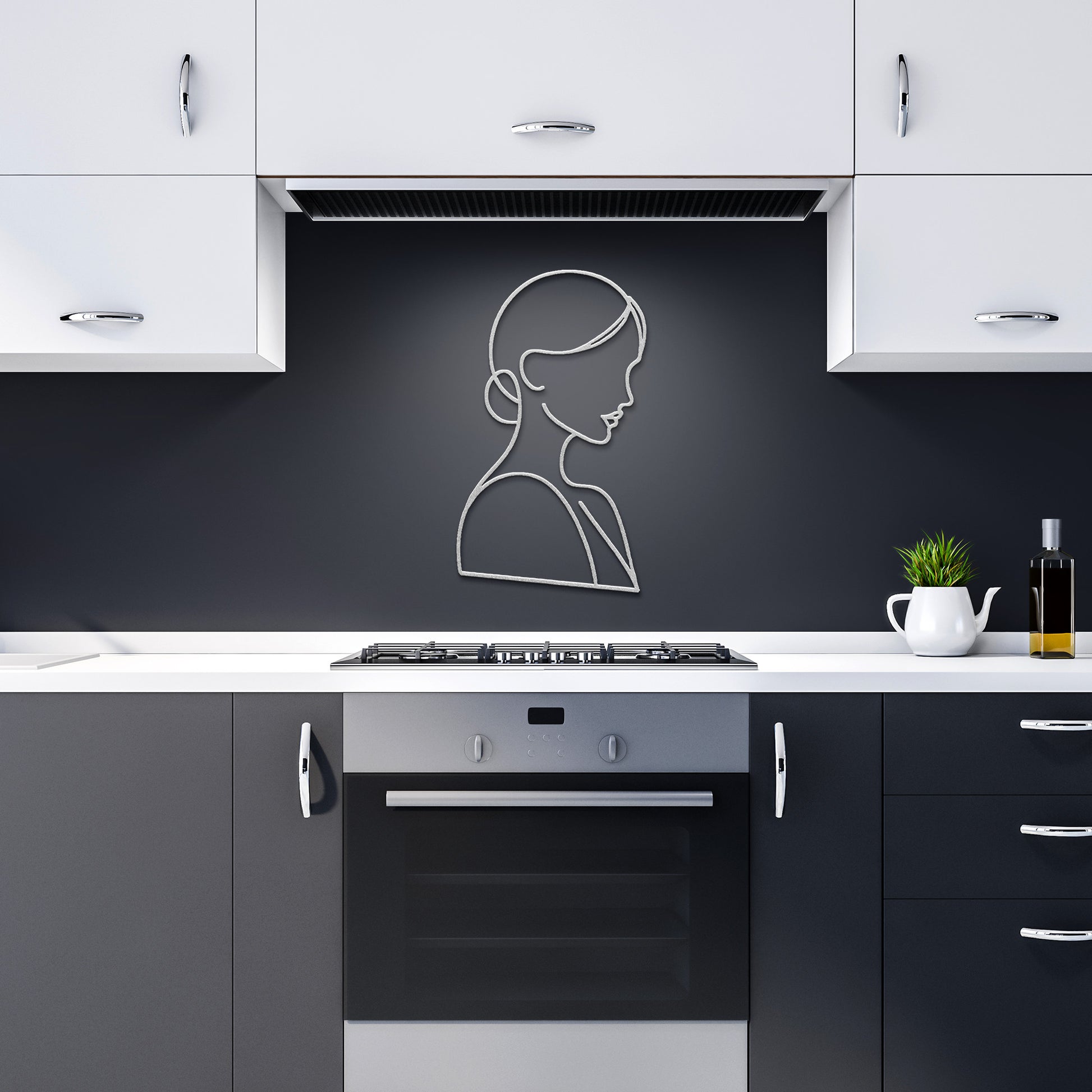 A minimalist kitchen features black and white cabinets, a modern oven, stovetop, and the "Woman Line Art" portrait on a dark backsplash. A powder-coated metal sign adds an artistic touch, enhancing the overall home decor.