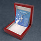 A Future Is Bright necklace with a cross and graduation cap charm inside a gift box featuring an inspirational message for a graduate. The Future Is Bright necklace is made of stainless steel and hangs on a ball chain.