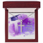 Silver ShineOn Fulfillment cross necklace with a lobster clasp, placed in a gift box with a graduation cap design and the inscription, "I can do all things through Christ!