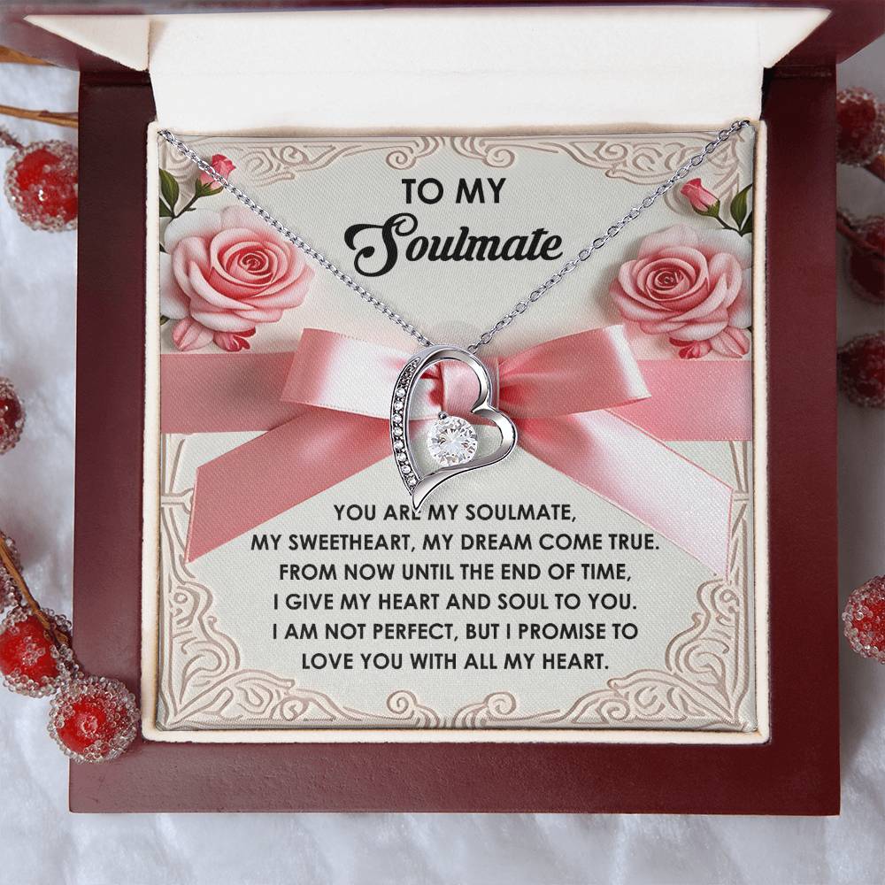 The Soulmate-Heart And Soul - Forever Love Necklace has a heart-shaped pendant with a CZ crystal, presented in a box with a romantic note and adorned with decorative berries and flowers.