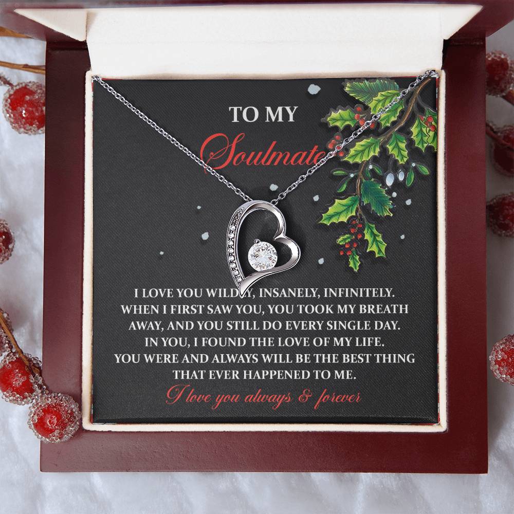 The Soulmate-You Still Do - Forever Love Necklace, featuring a heart design, comes in a holly-decorated box with the message: "To my soulmate, I love you wildly, insanely, infinitely... I love you always & forever," making it an ideal personalized gift.