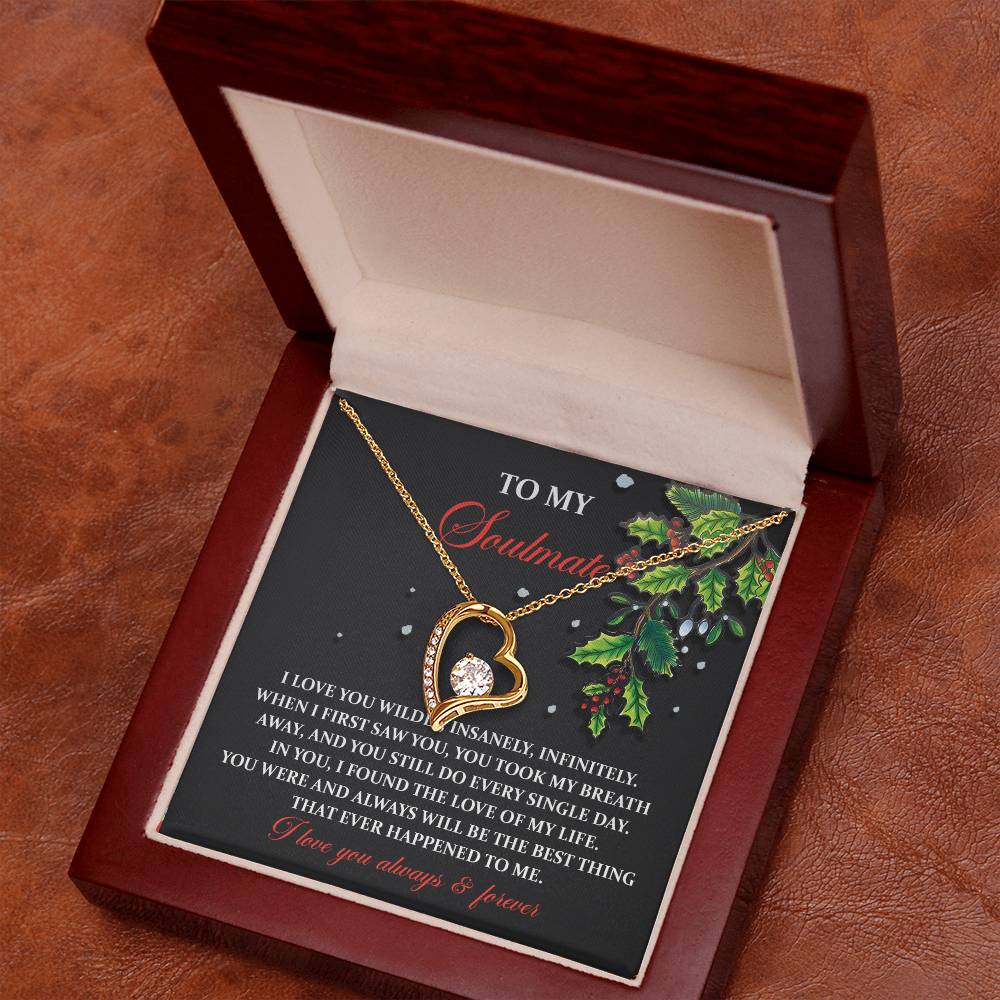 The Soulmate-You Still Do - Forever Love Necklace is a stunning gold heart-shaped jewelry piece with a diamond pendant, nestled in a wooden box. This personalized gift features an inscription to your soulmate on a holiday-themed card adorned with holly.