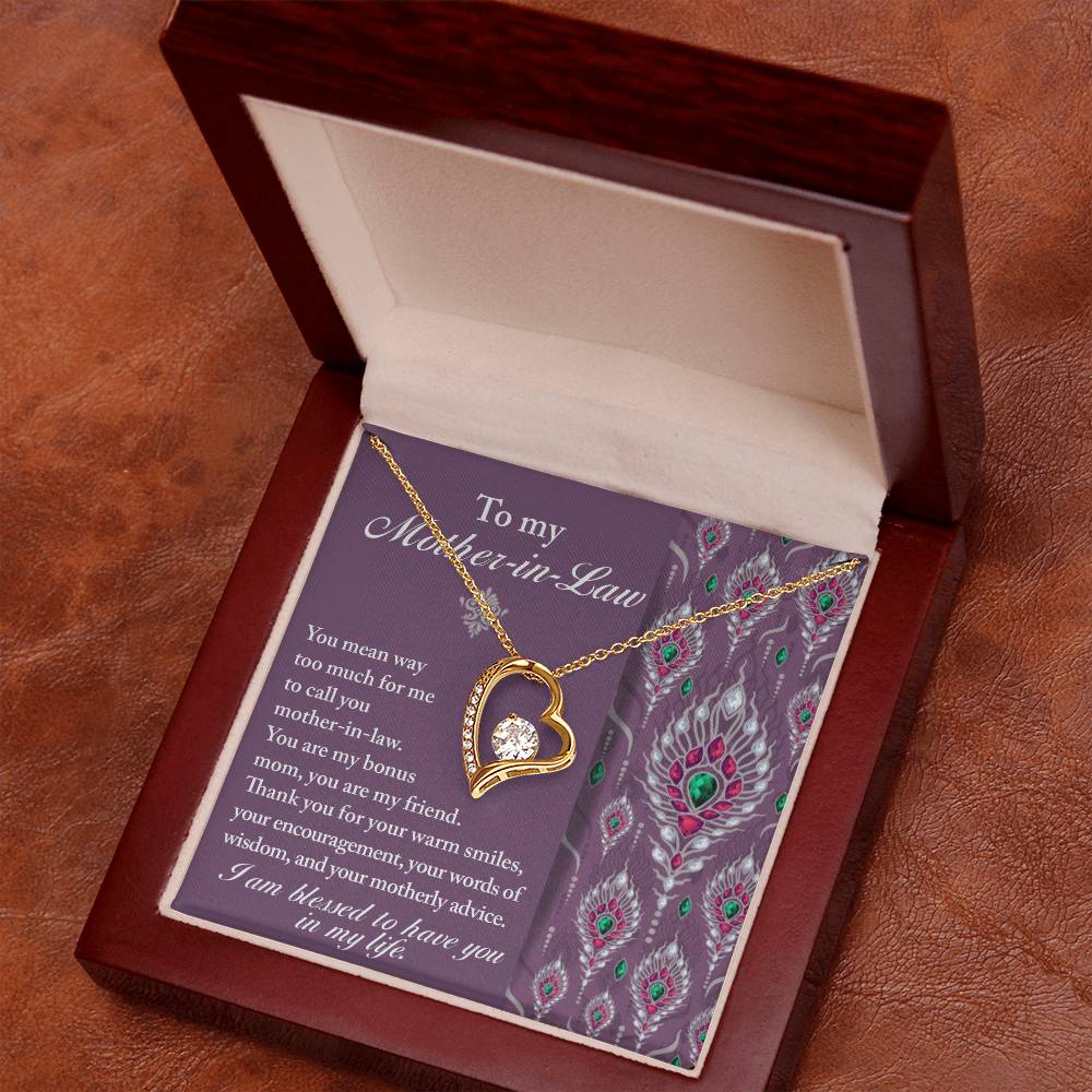 The "To Mother-In-Law, Words Of Wisdom - Forever Love Necklace" features a gold heart-shaped pendant presented in a wooden box, accompanied by a card that reads "To my Mother-in-Law" and includes a heartfelt message, making it the perfect personalized gift.