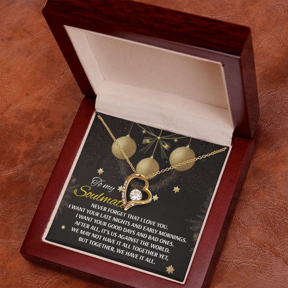 The Soulmate-Have It All - Forever Love Necklace, featuring a CZ crystal and a gold heart-shaped pendant, is presented in a wooden box with a message card. The card highlights an affectionate message set against an elegantly decorated background.