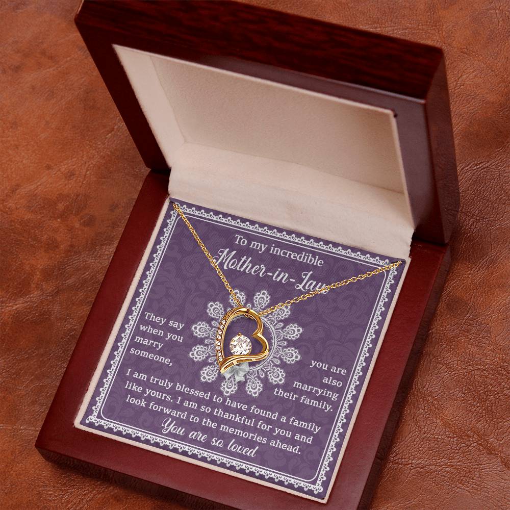 The "To Mother-In-Law, Family Like Yours - Forever Love Necklace" includes a heart-shaped pendant with a 14k white gold finish, presented in an elegant display box and accompanied by a heartfelt message card tailored for a mother-in-law. It's a unique gift that she'll cherish forever.