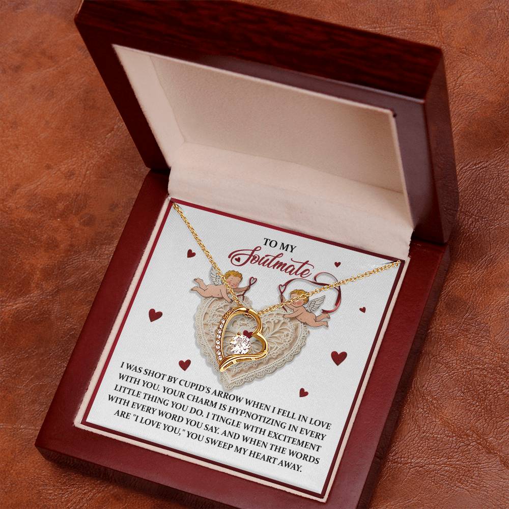 The Soulmate-Sweep My Heart - Forever Love Necklace showcases a gold-finished heart with a CZ crystal pendant in a red box, including a "To My Soulmate" card featuring Cupid, embodying timeless romance.