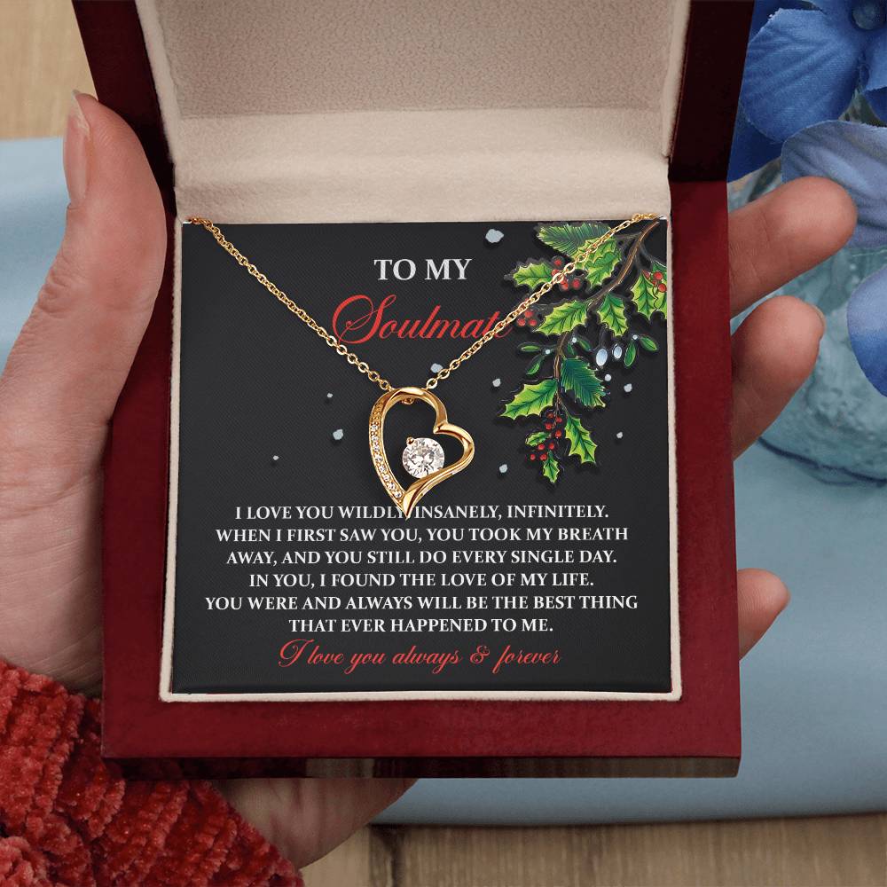 An open gift box reveals the Soulmate-You Still Do - Forever Love Necklace, featuring a heart-shaped pendant with a diamond, elegantly set on a "To My Soulmate" card bearing a heartfelt love message. This personalized gift beautifully symbolizes eternal devotion and connection.