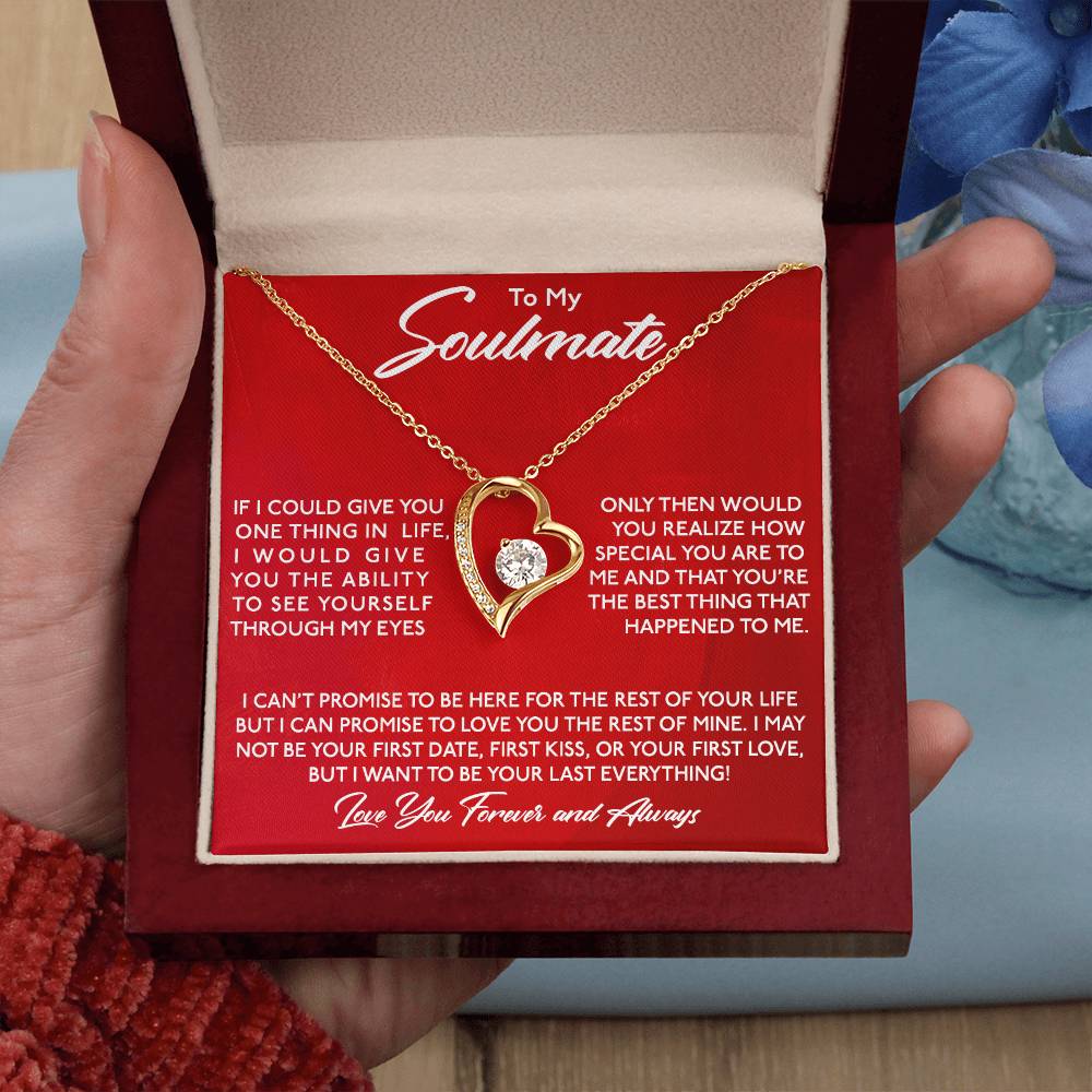 A hand holding a red gift box with the To My Soulmate, You Are Special To Me - Forever Love Necklace pendant and a romantic message for a soulmate. The pendant is part of the ShineOn Fulfillment Forever Love Necklace collection, featuring a gold finish and cubic zircon.