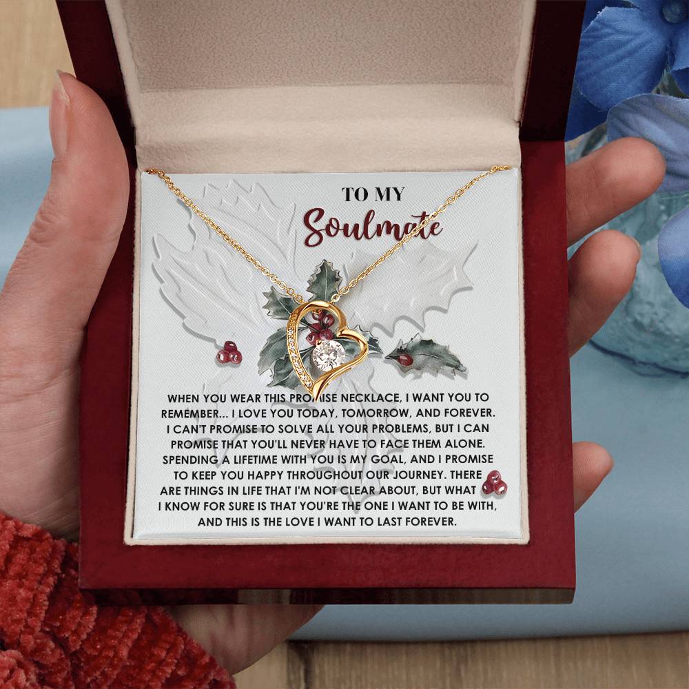 A hand holds an open box displaying the Soulmate-To Be With - Forever Love Necklace featuring a heart-shaped pendant and a heartfelt message card for a soulmate.