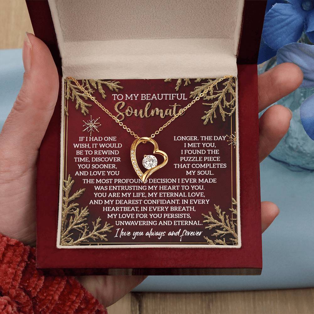 A hand showcases a jewelry box containing the Soulmate-Rewind Time - Forever Love Necklace. The lid features a romantic message framed by gold accents, making it an ideal gift for your soulmate to symbolize eternal love.