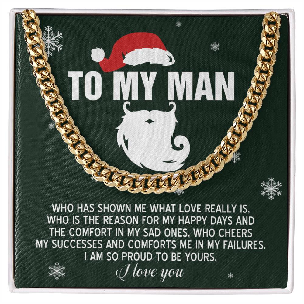 A green gift box containing the elegant "My Man-To Be Yours - Cuban Link Chain" in polished stainless steel with a gold finish. The box features the heartfelt message, "To My Man," surrounded by snowflake designs. This adjustable Cuban link chain blends style and sentiment into one sophisticated package.