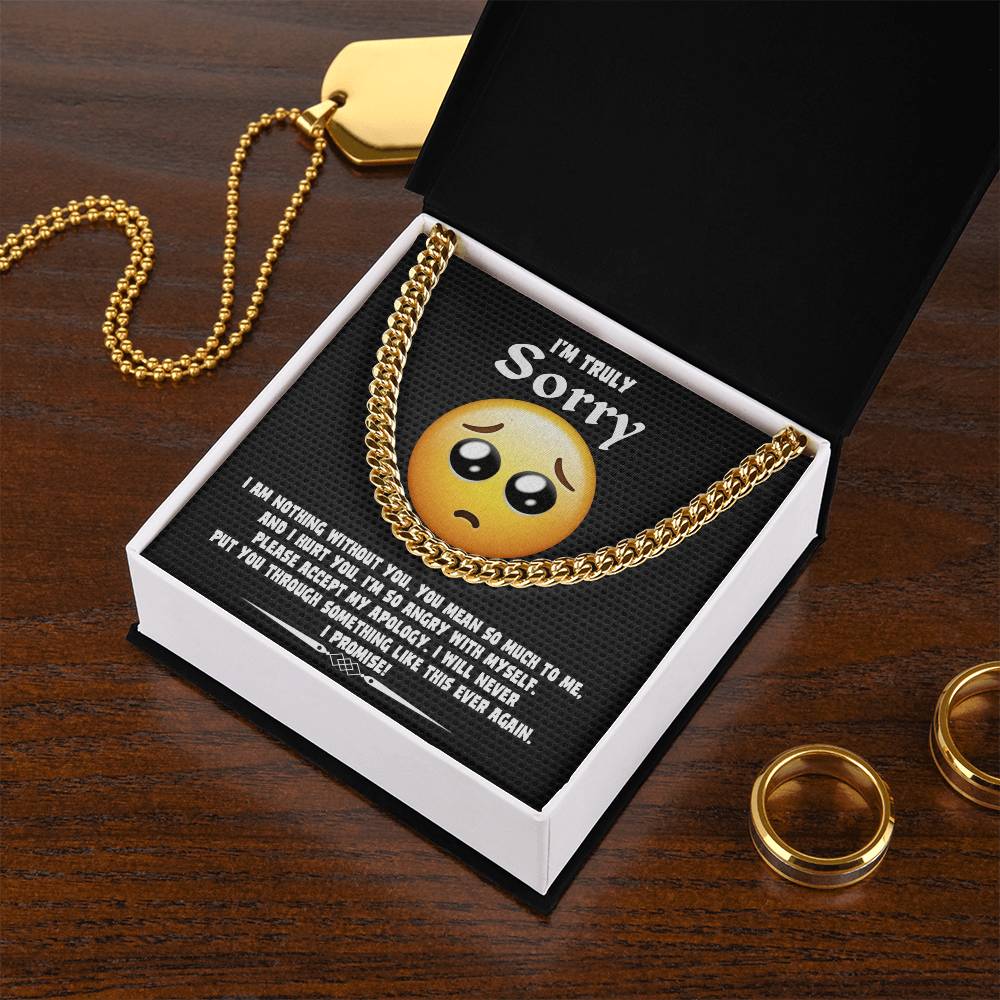 A Sorry-Accept My Apology Cuban Link Chain draped over a note featuring a sad emoji and an apology message, expressing regret and a promise never to repeat the mistake.