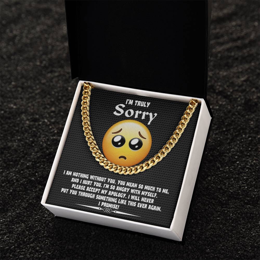 A Sorry-Accept My Apology Cuban Link Chain draped over a note featuring a sad emoji and an apology message, expressing regret and a promise never to repeat the mistake.