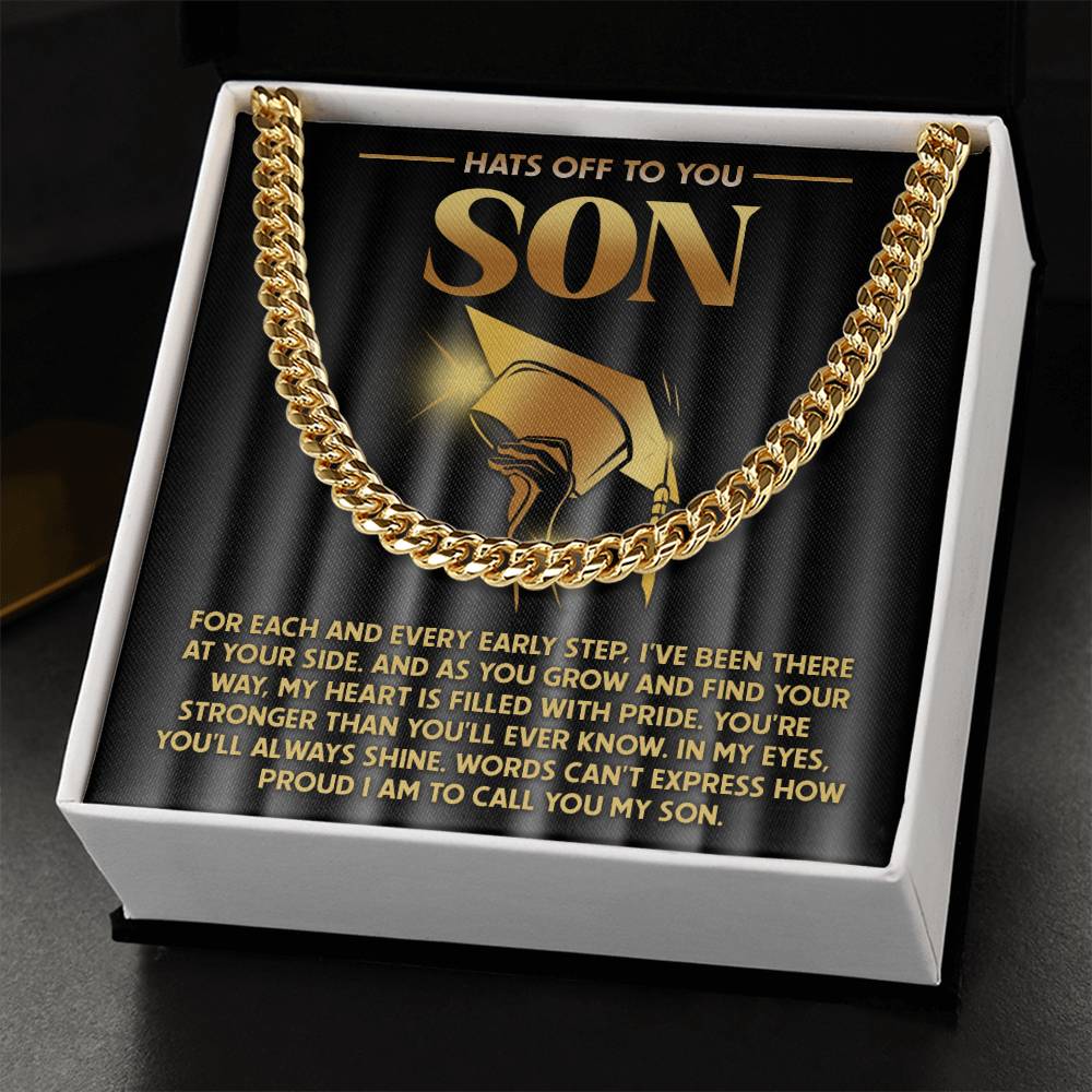 The "To Son, You'll Always Shine - Cuban Link Chain" necklace in a gift box features a heartfelt message with a golden hat illustration. Made of 14K yellow gold, it's an elegant personalized necklace perfect for any special occasion.