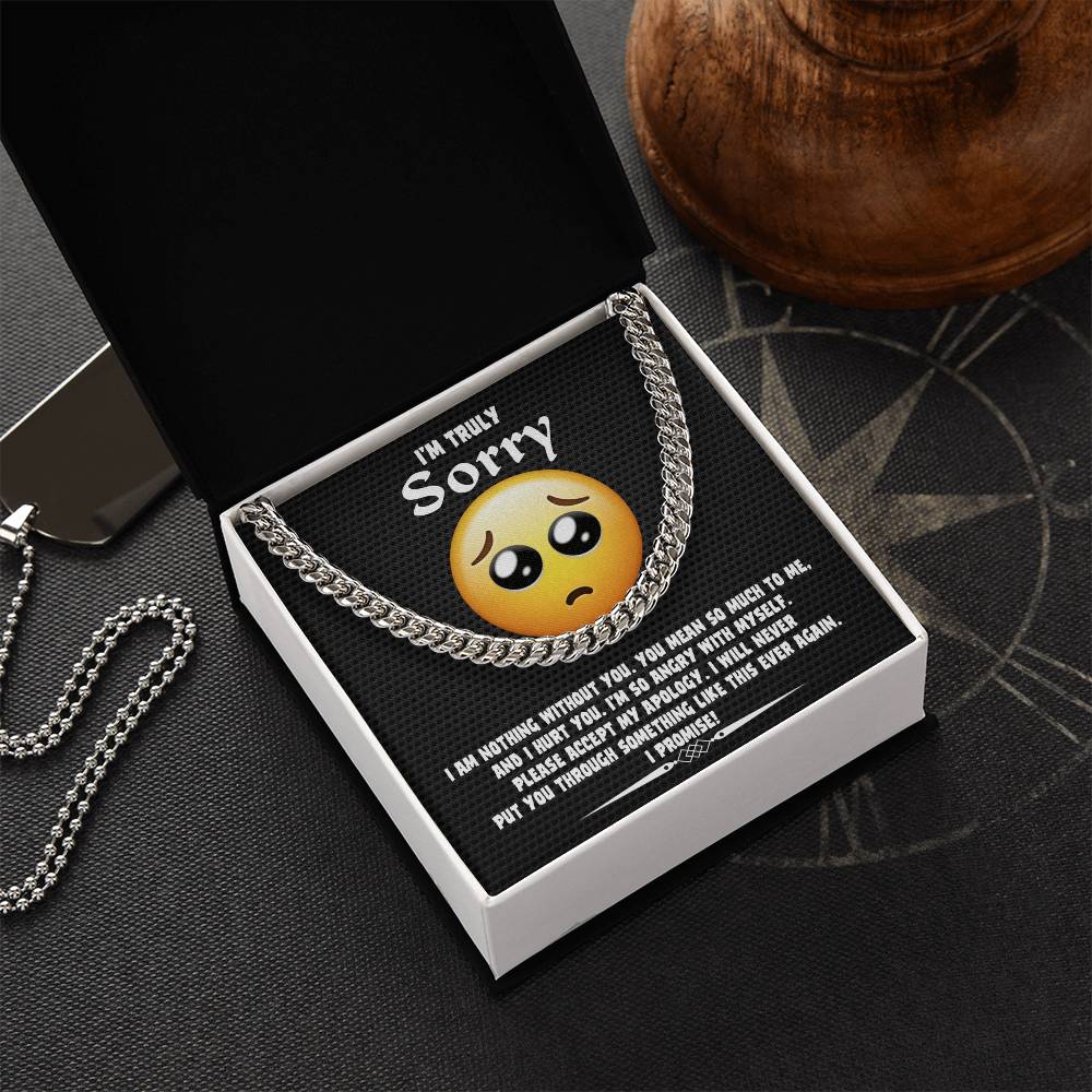 A Sorry-Accept My Apology Cuban Link Chain draped over a note featuring a sad emoji and an apology message, expressing regret and a promise never to repeat the mistake.