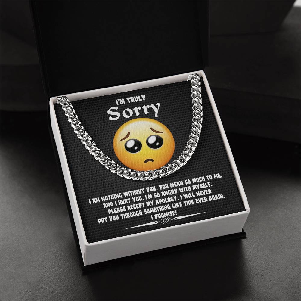 A Sorry-Accept My Apology Cuban Link Chain draped over a note featuring a sad emoji and an apology message, expressing regret and a promise never to repeat the mistake.