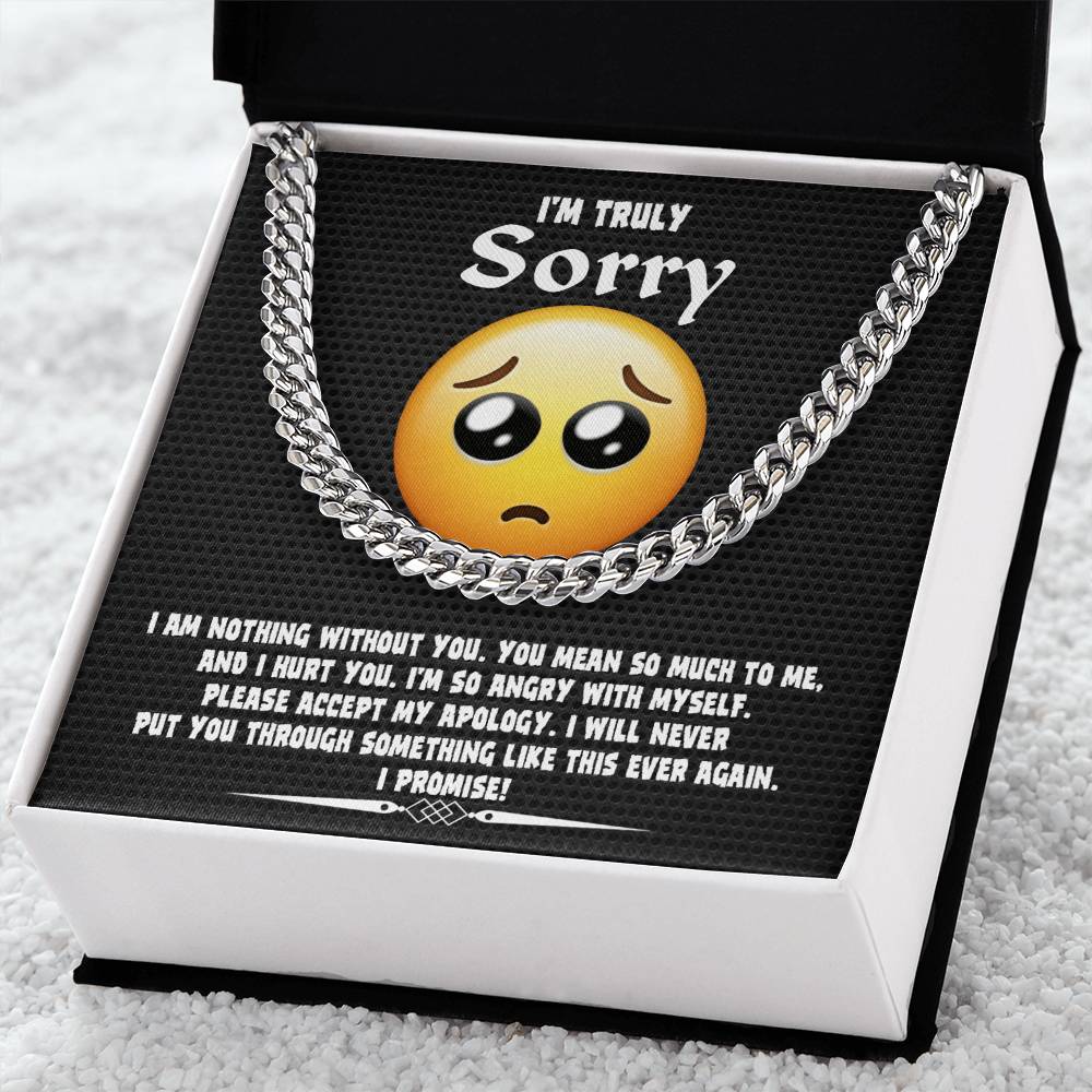A Sorry-Accept My Apology Cuban Link Chain draped over a note featuring a sad emoji and an apology message, expressing regret and a promise never to repeat the mistake.