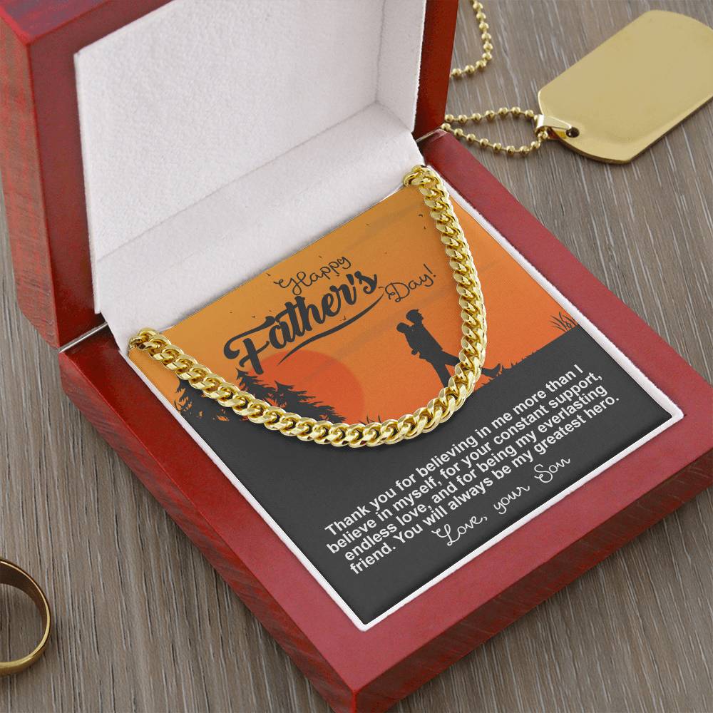 The "To Dad, My Greatest Hero - Cuban Link Chain," made of 14K yellow gold, elegantly rests in a red jewelry box with a heartfelt Father's Day card.