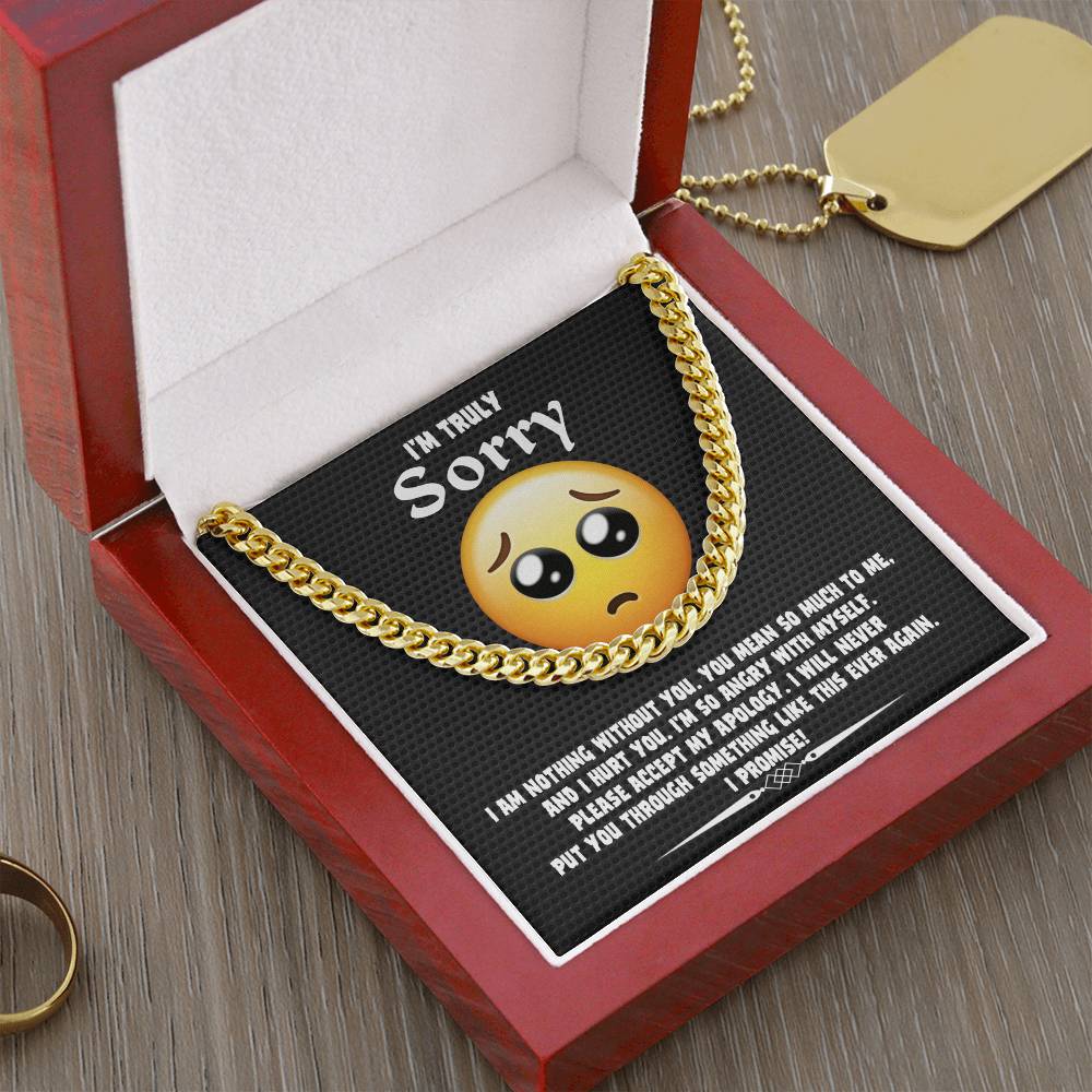 A Sorry-Accept My Apology Cuban Link Chain draped over a note featuring a sad emoji and an apology message, expressing regret and a promise never to repeat the mistake.