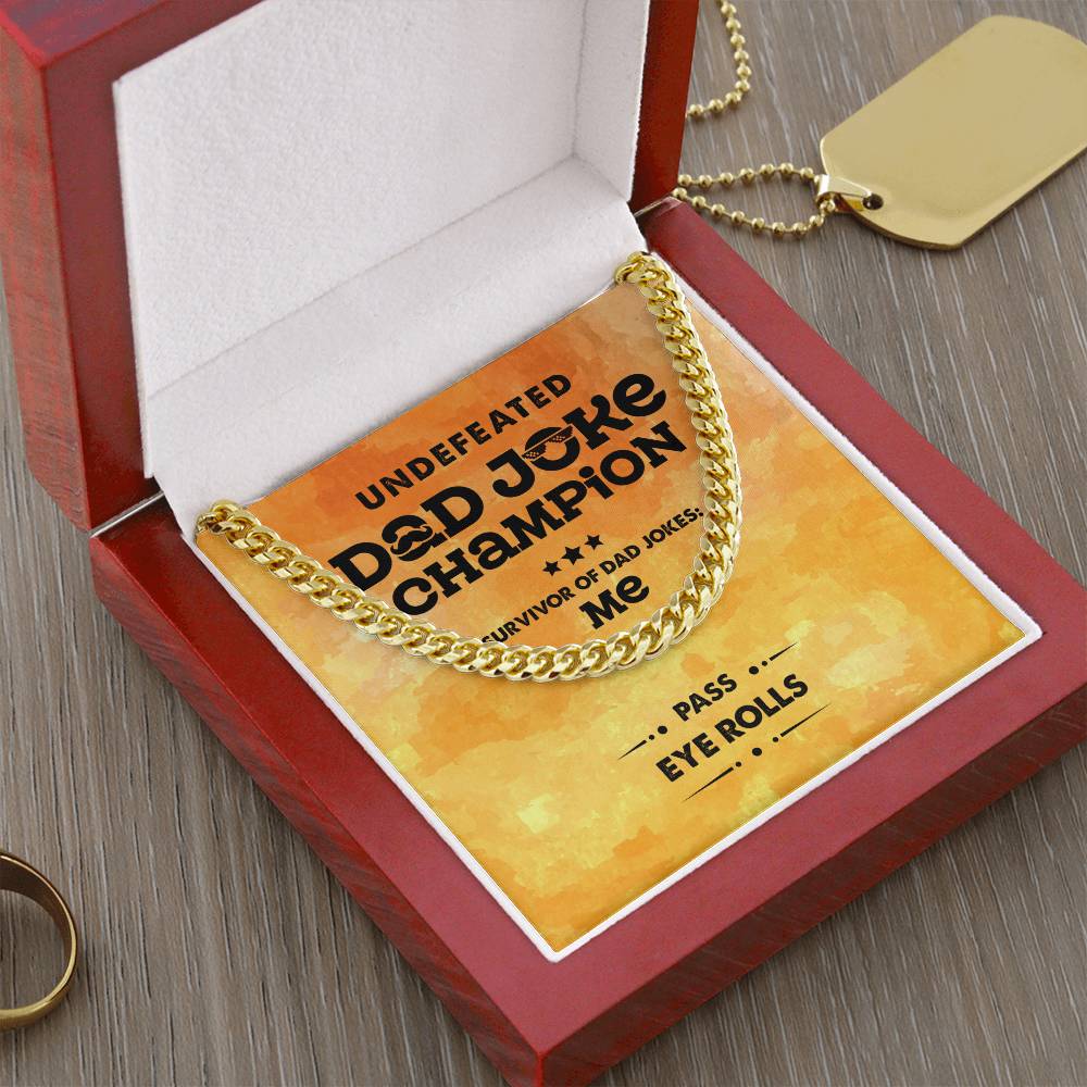 A framed text reads "Undefeated Dad Joke Champion - Survivor of Dad Jokes: Me," with additional text at the bottom that says "Pass Eye Rolls." A polished stainless steel To Dad, Dad Joke Champion - Cuban Link Chain is draped over the frame.