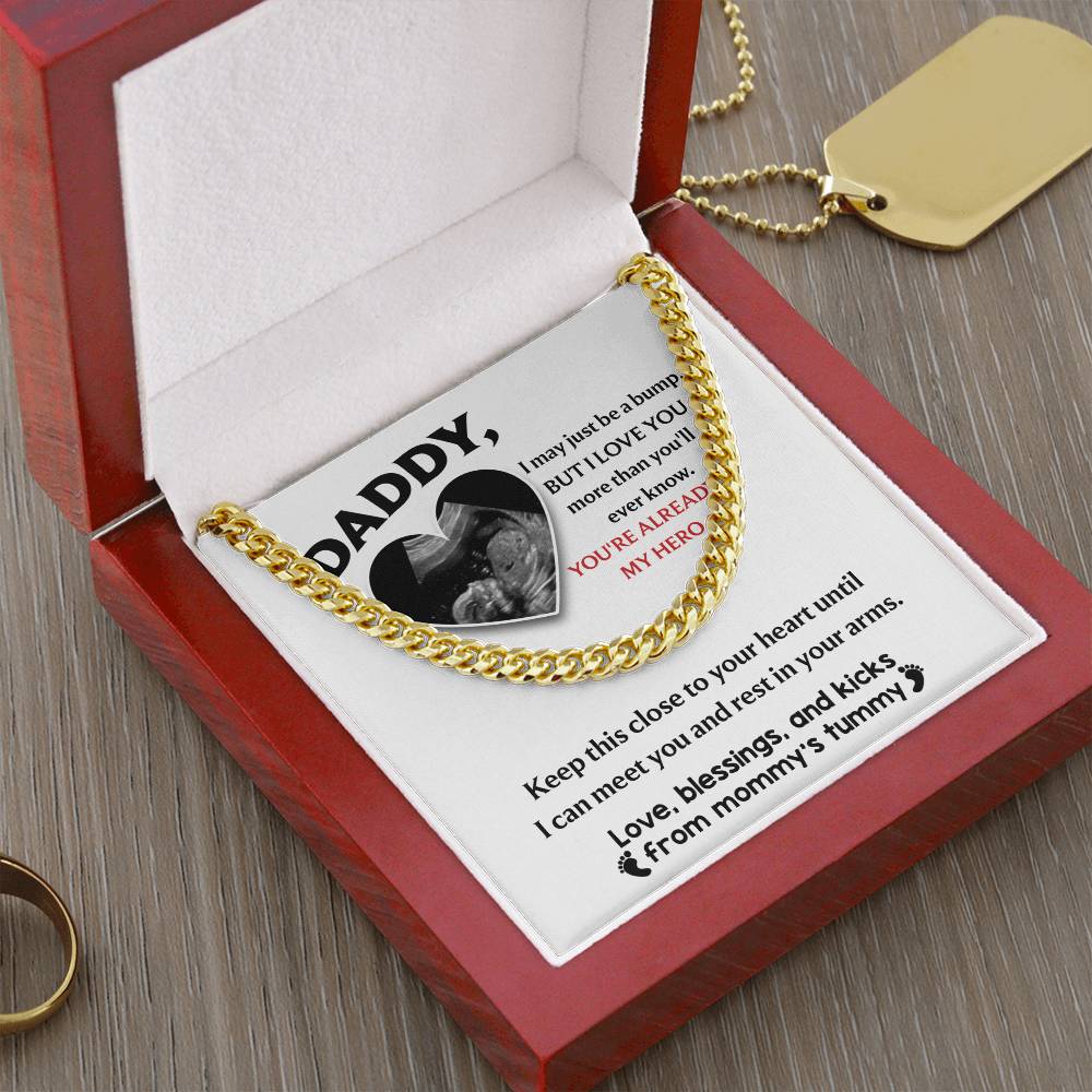 The "To Dad, To Your Heart - Cuban Link Chain" features a polished gold design in a red box with a heartfelt message card for "Daddy," celebrating the upcoming baby and love from "mommy's tummy.