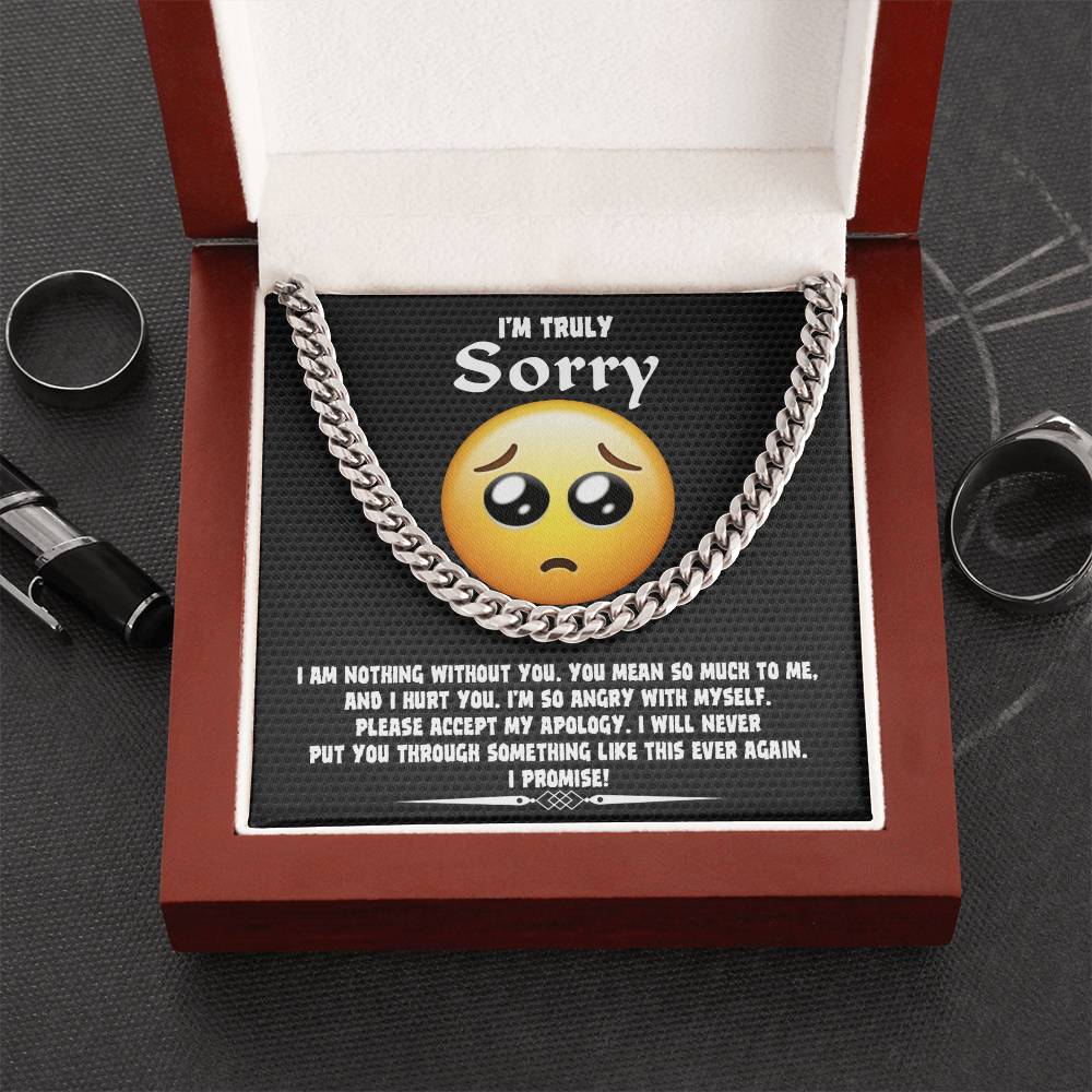 A Sorry-Accept My Apology Cuban Link Chain draped over a note featuring a sad emoji and an apology message, expressing regret and a promise never to repeat the mistake.