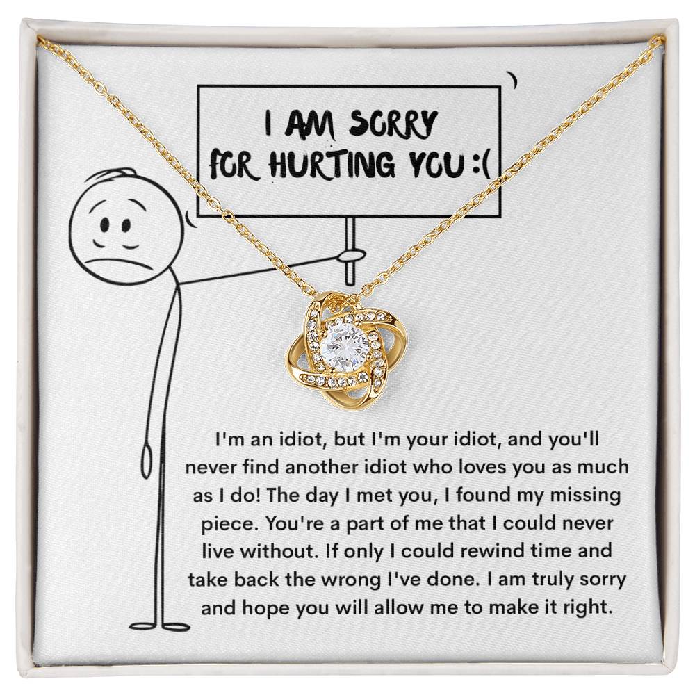 The Sorry-Missing Piece - Love Knot Necklace, adorned with cubic zirconia crystals, is displayed in a box with a heartfelt message of apology and love.