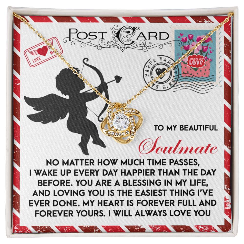 The Soulmate-Forever Yours Love Knot Necklace showcases an intertwined design on a card with a cupid and a heartfelt soulmate message. Adorned with cubic zirconia, it is an ideal personalized gift that celebrates love's beauty.
