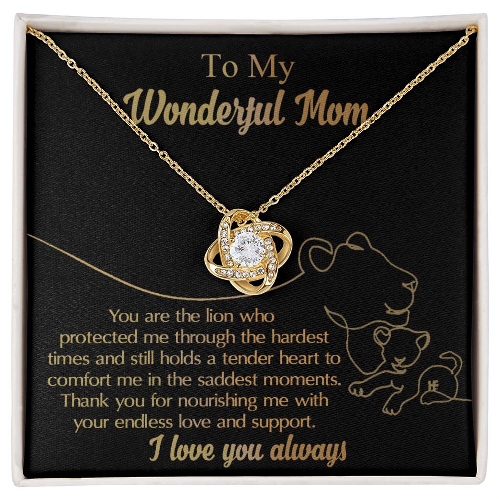 To Mom, The Lion - Love Knot Necklace made from white gold, featuring a cubic zirconia centerpiece, showcased on a black background with the heartfelt message: 'To My Wonderful Mom. You are the lion who protected me through the hardest times... Thank you for your love and support.'