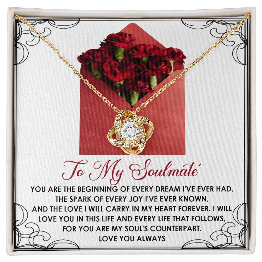 The Soulmate-My Heart Forever Love Knot Necklace features a cubic zirconia pendant on a card adorned with red carnations and a heartfelt message to your soulmate.