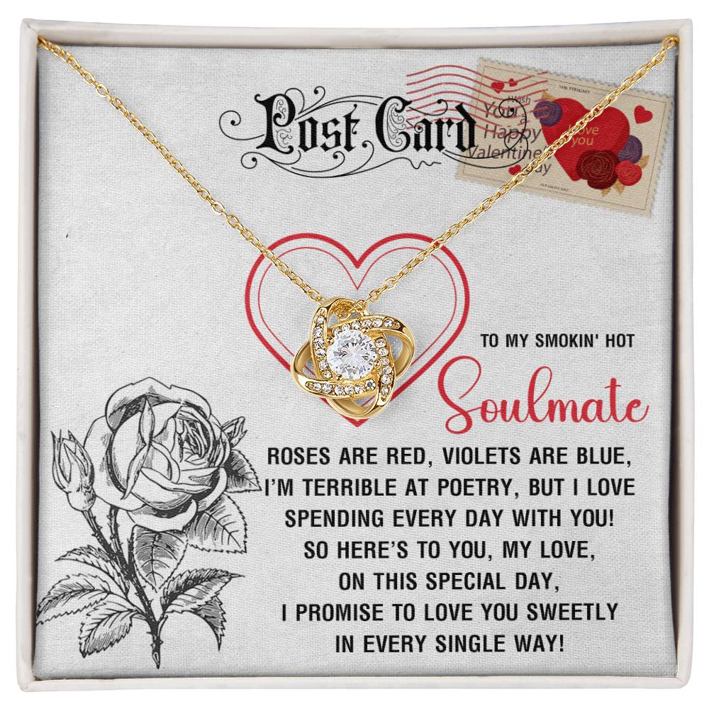 The Soulmate-Special Day Love Knot Necklace features a heart-shaped pendant on a postcard background with a love poem and rose illustration. Adorned with cubic zirconia crystals, it displays "To my smokin' hot soulmate" for Valentine's Day, perfect in yellow gold finish.