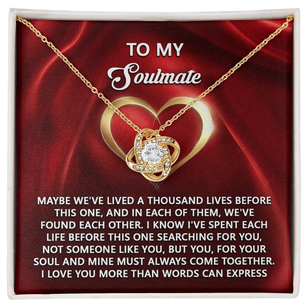 Soulmate-Your Soul - Love Knot Necklace featuring a heart-shaped pendant on a red background. The text "To My Soulmate" and a heartfelt message about eternal love are included, with sparkling cubic zirconia embellishments. A personalized gift representing timeless affection and devotion.