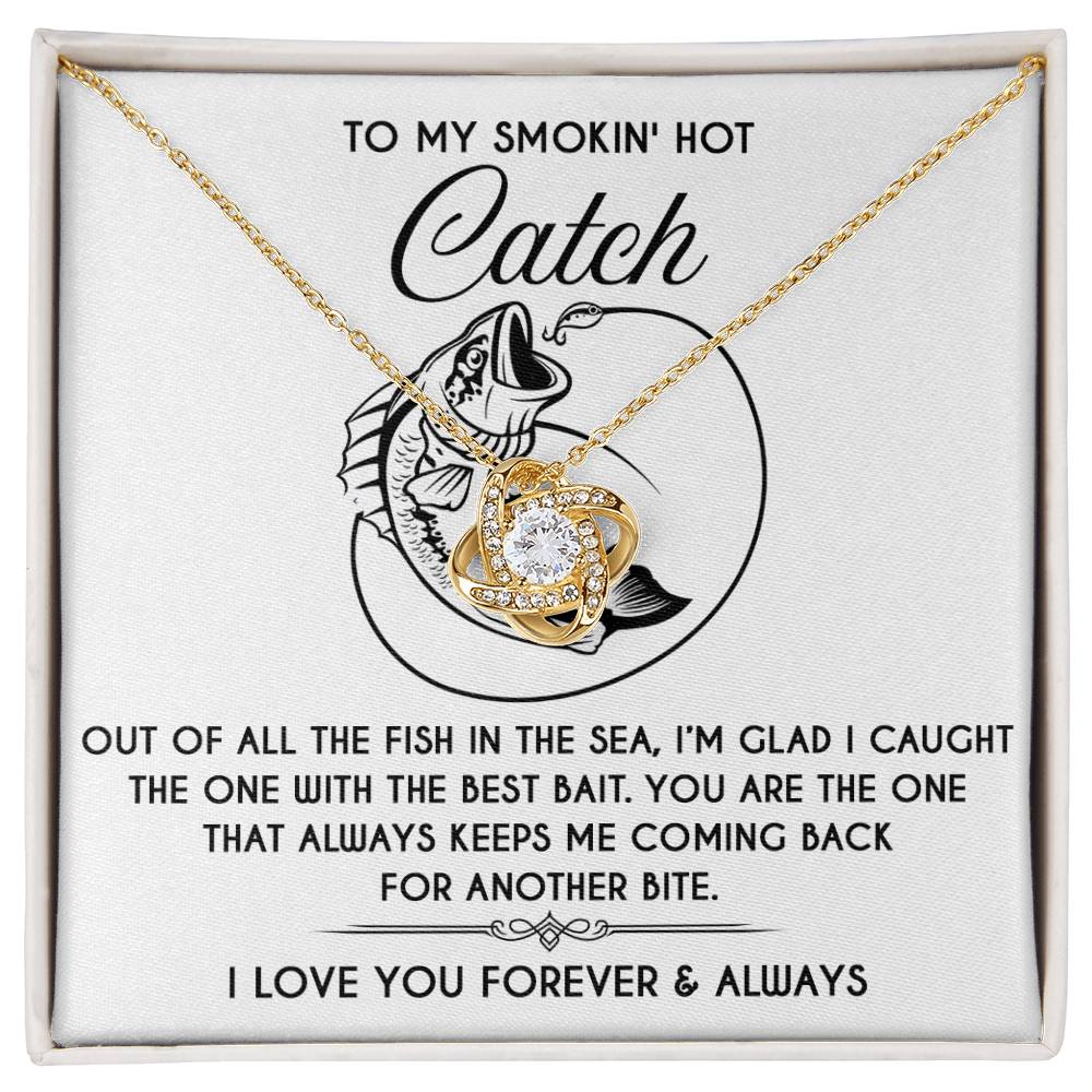 The Soulmate-Another Bite - Love Knot Necklace, adorned with sparkling cubic zirconia, features interlocking hearts placed on a box with a romantic fishing-themed message. Ideal as a personalized gift for someone special.