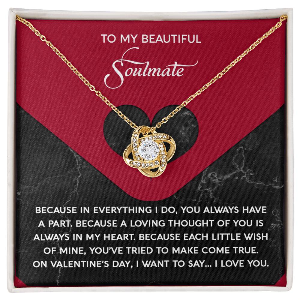 The Soulmate-Loving Thought - Love Knot Necklace showcases a heart-shaped pendant adorned with cubic zirconia crystals. Presented on a black and red card, it reads "To my beautiful soulmate" followed by a heartfelt message, making it an ideal personalized gift.