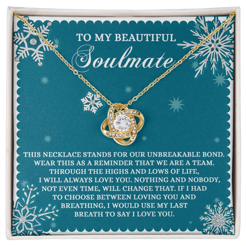 Soulmate-A Team Love Knot Necklace featuring an infinity heart pendant, enclosed in a decorative box. Embellished with Cubic Zirconia Crystals, it conveys a heartfelt message about the unbreakable bond of love and unity.
